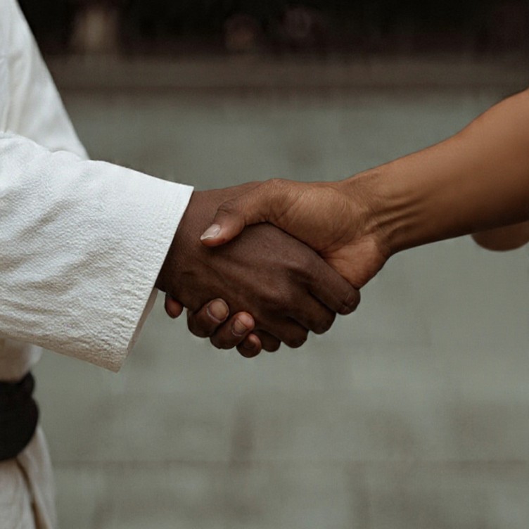 Greeting handshake with person in BJJ Gi